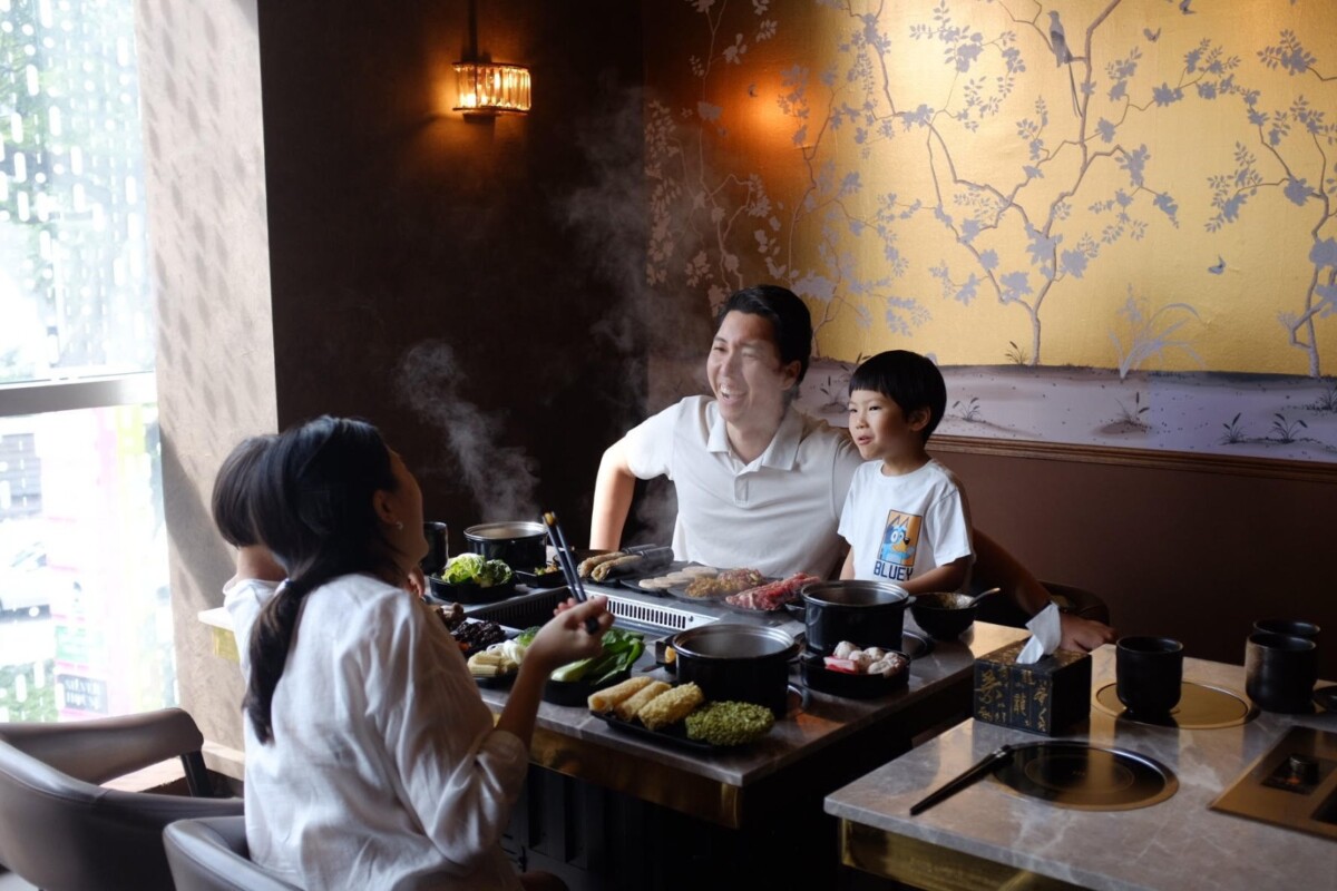 Family dining at JING Halal Hotpot and Grill at KINEX Mall Singapore