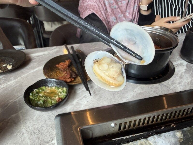 Open clam with full meaty body lifted from the JING hotpot