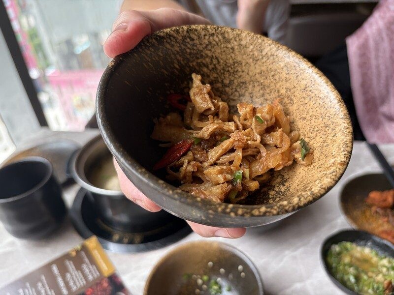 Wok-fried radish with cuttlefish, dried chillies and spring onions at JING
