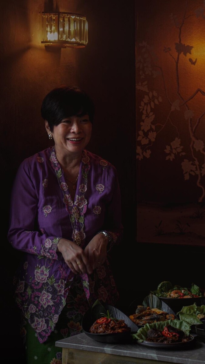Auntie Veron in purple Peranakan kebaya at JING for the Mother's Day Peranakan collaboration in Singapore May 2026