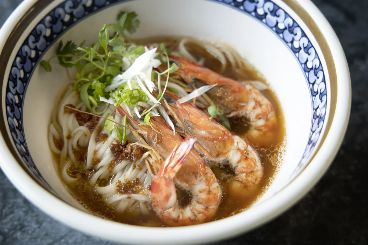Himeshima Hae Mee at Kinki, tiger prawns on udon in a blue and white bowl