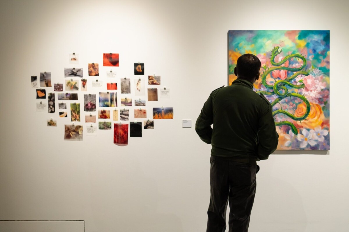 Visitor viewing Diploma in Fine Arts works by Sarah Yeo and Zhang Yalan at LASALLE