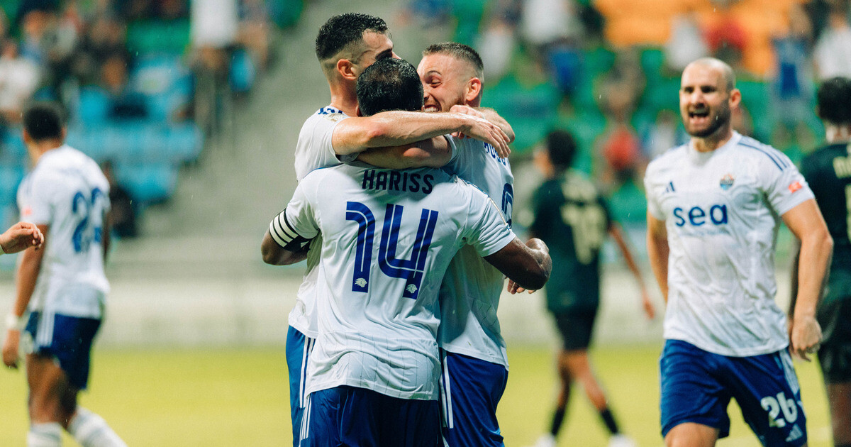 Lion City Sailors players hug after a goal against Tanjong Pagar United at Jalan Besar Stadium