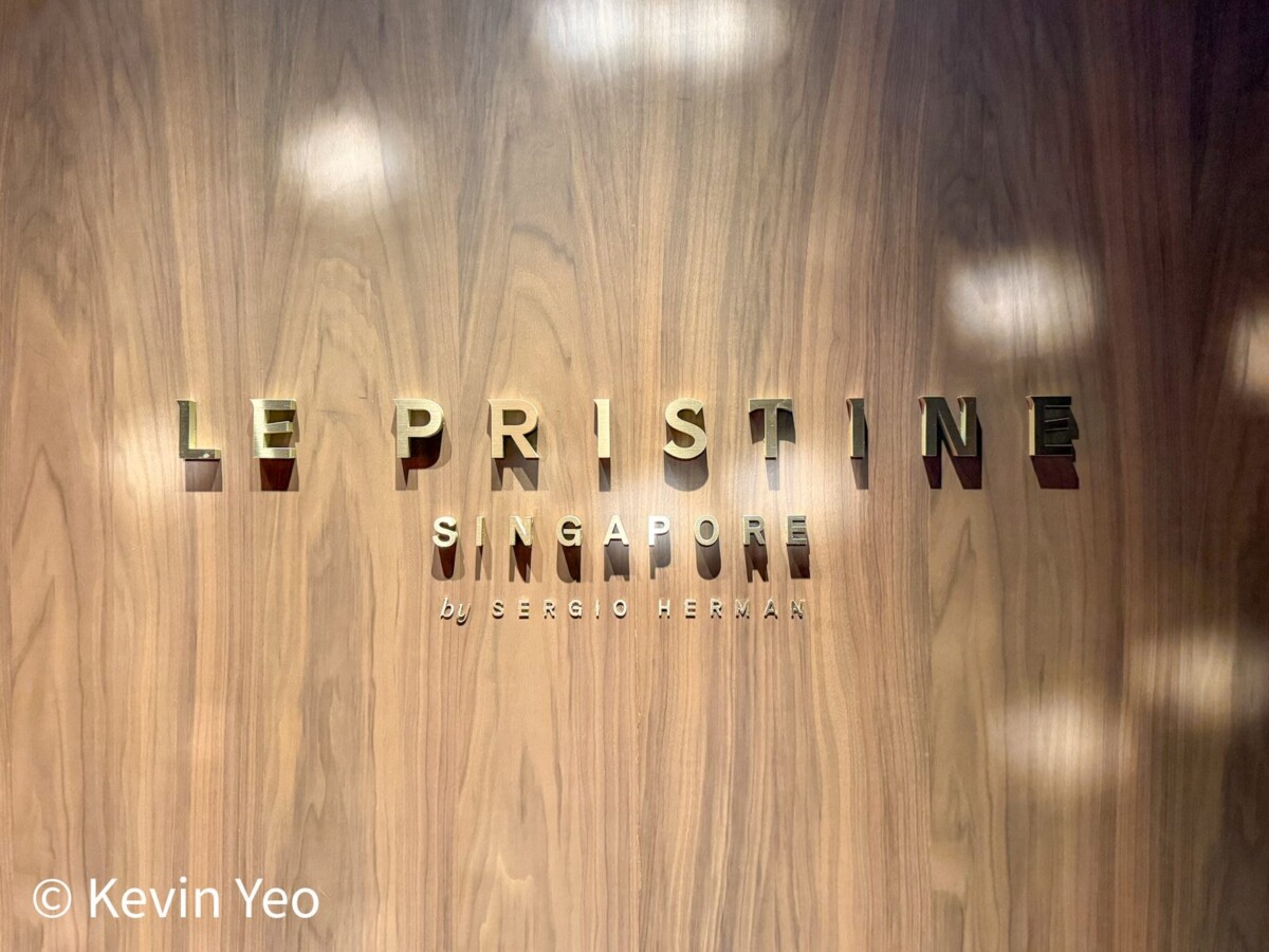 Brass signage at Le Pristine Singapore by Sergio Herman inside Grand Hyatt