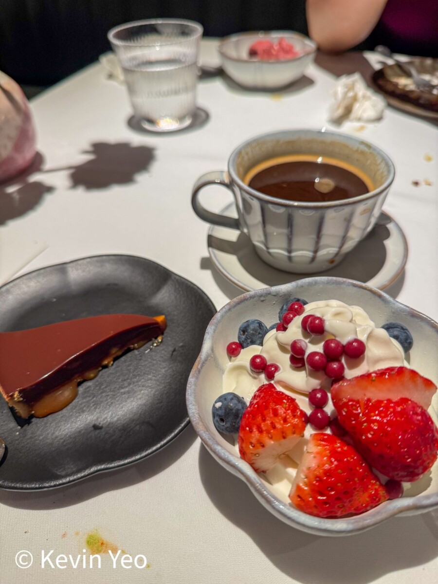 Plated chocolate tart with panna cotta and fresh berries at Le Pristine Singapore