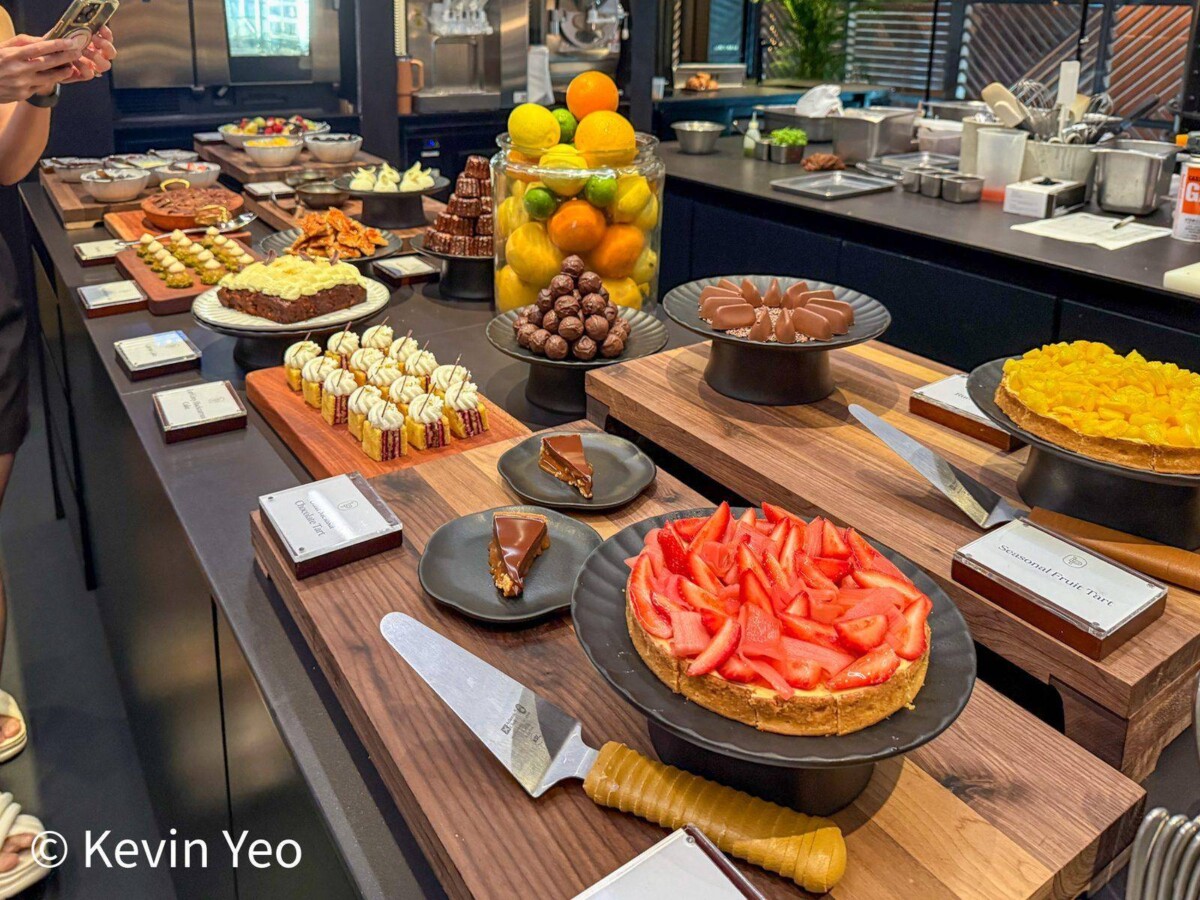 Sweet bar at Le Pristine Singapore with strawberry tart chocolate cake and mini pastries