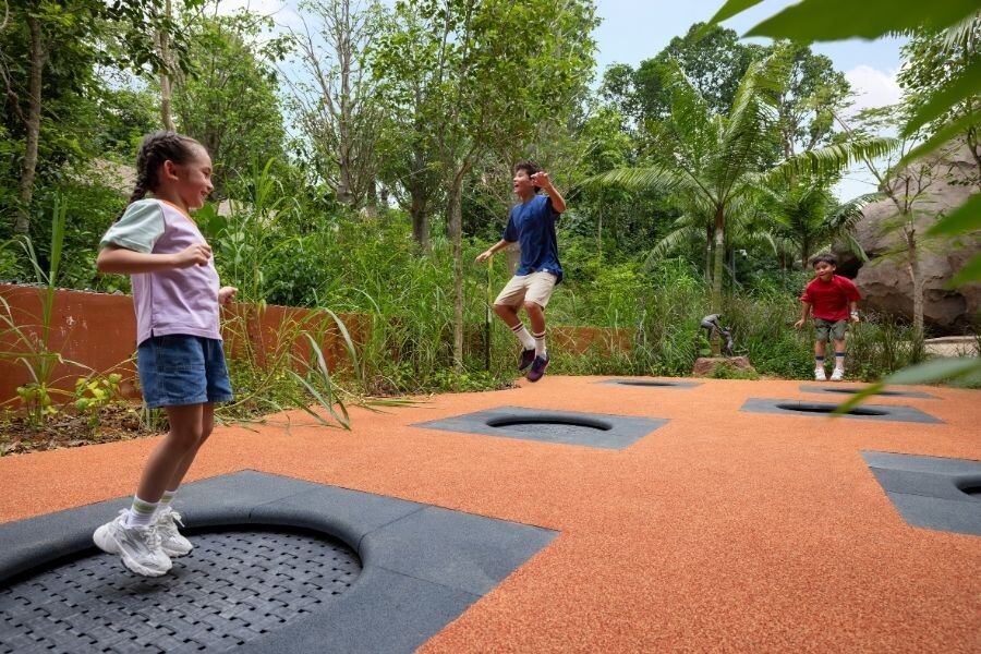 Children bouncing on the trampolines at Lemur Playground in Rainforest Wild Adventure EAST