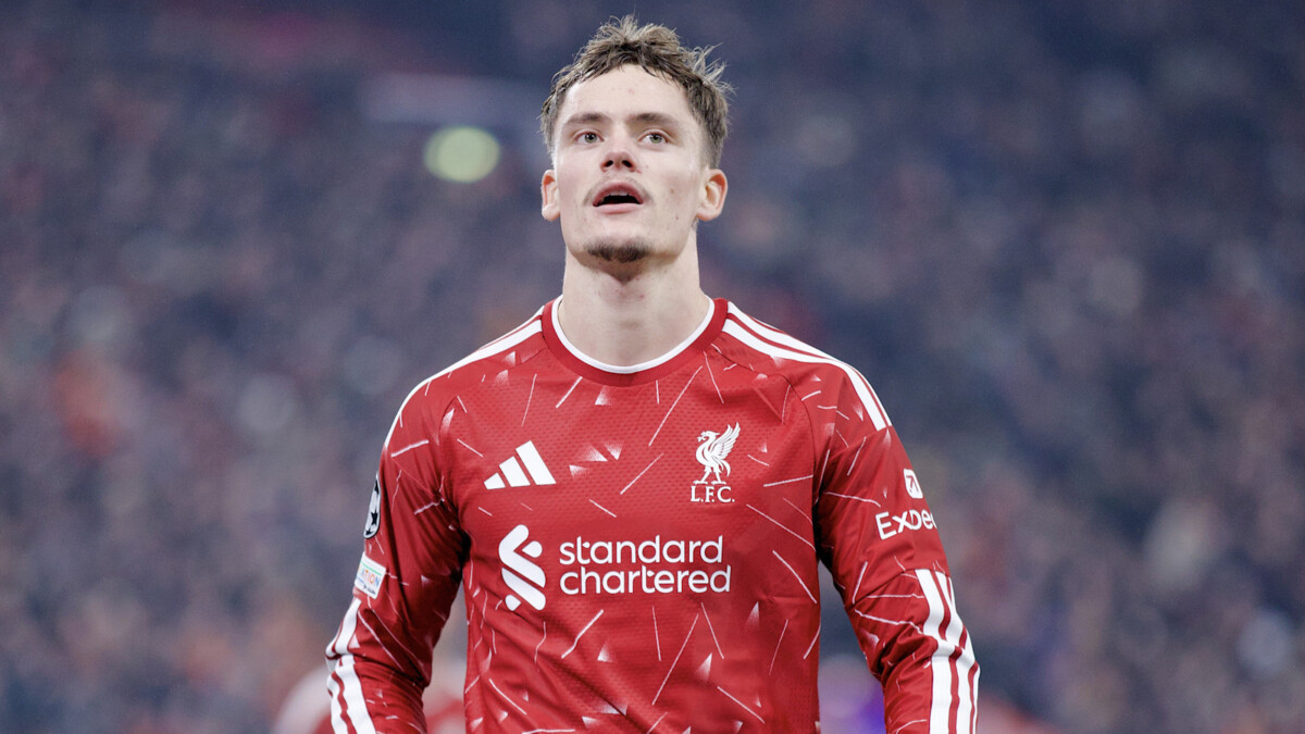 A Liverpool player in the red home kit at Anfield
