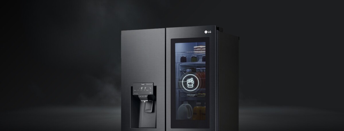 LG InstaView side-by-side refrigerator with lit glass door panel