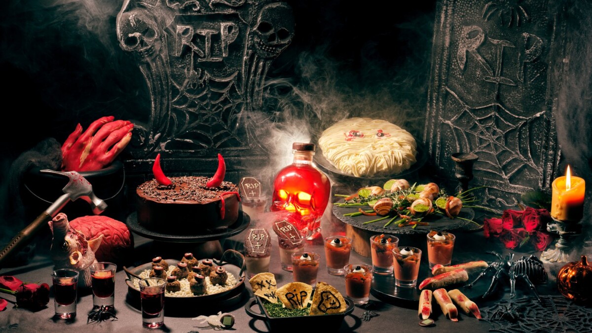 Halloween dessert and buffet spread with tombstones and skull bottle at Lime Restaurant, PARKROYAL COLLECTION Pickering