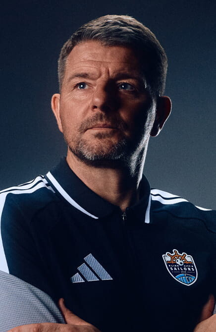 Lion City Sailors coach in club Adidas kit portrait