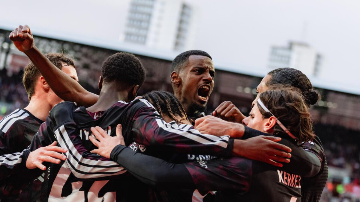 Liverpool players including Alexander Isak celebrate a goal against Brentford at Gtech Community Stadium