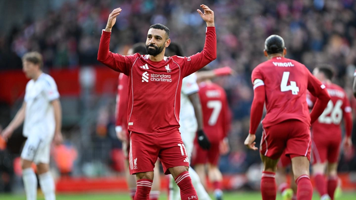 Liverpool players celebrate during their 2-0 victory over Fulham at Anfield