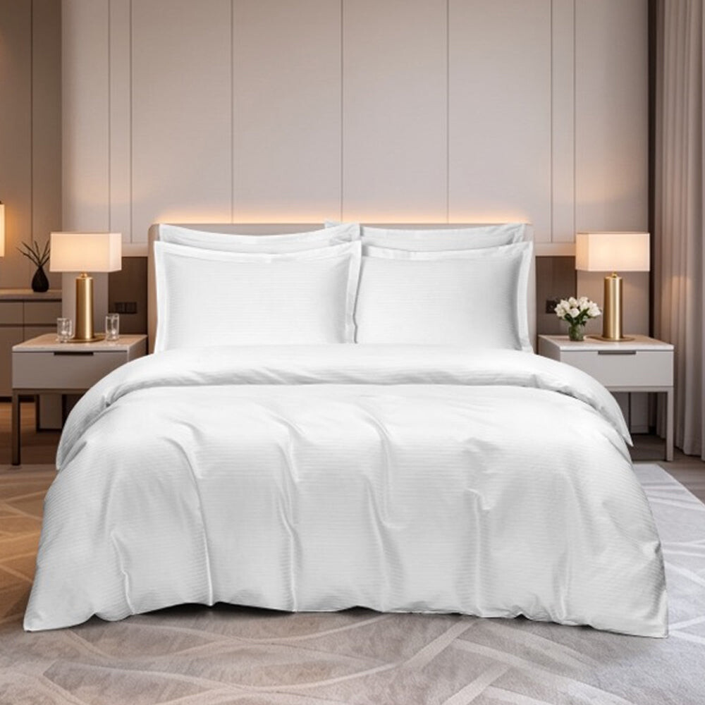 Maison de Claire cotton dobby fitted sheet set in white on a bed