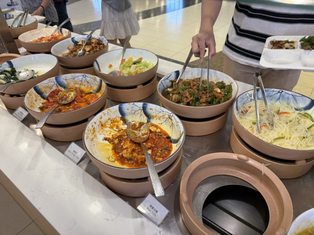 Mapo tofu and hot dish line at Hundred Grains CityLink