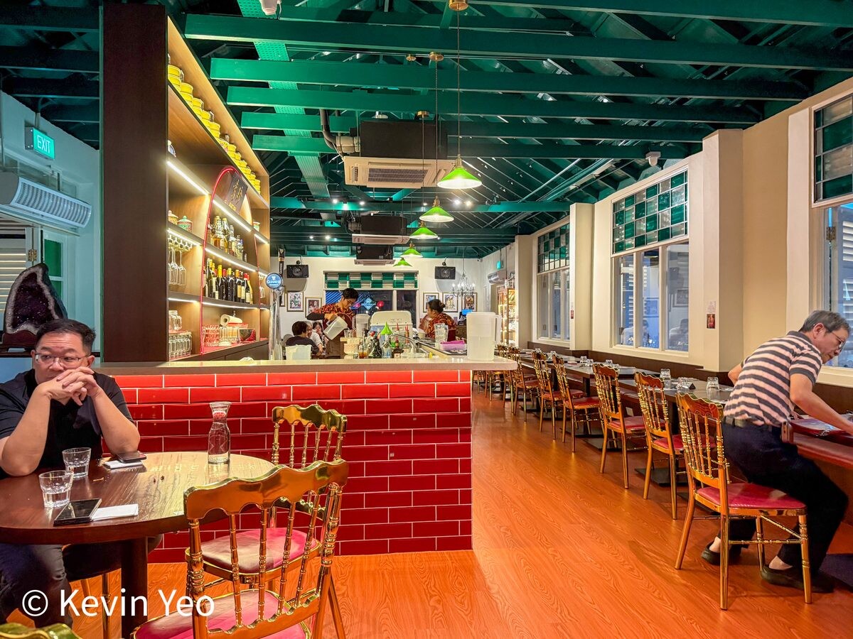 Martina's Kitchen interior Peranakan decor with green ceiling beams and gold chairs