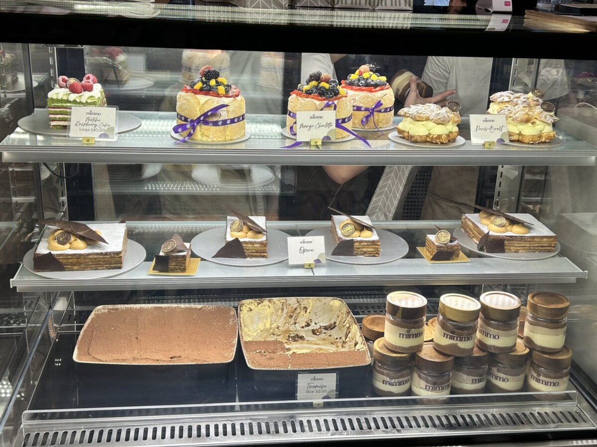 Mimmo Bakery Singapore cake display with Mango Charlotte Opera and tiramisu jars