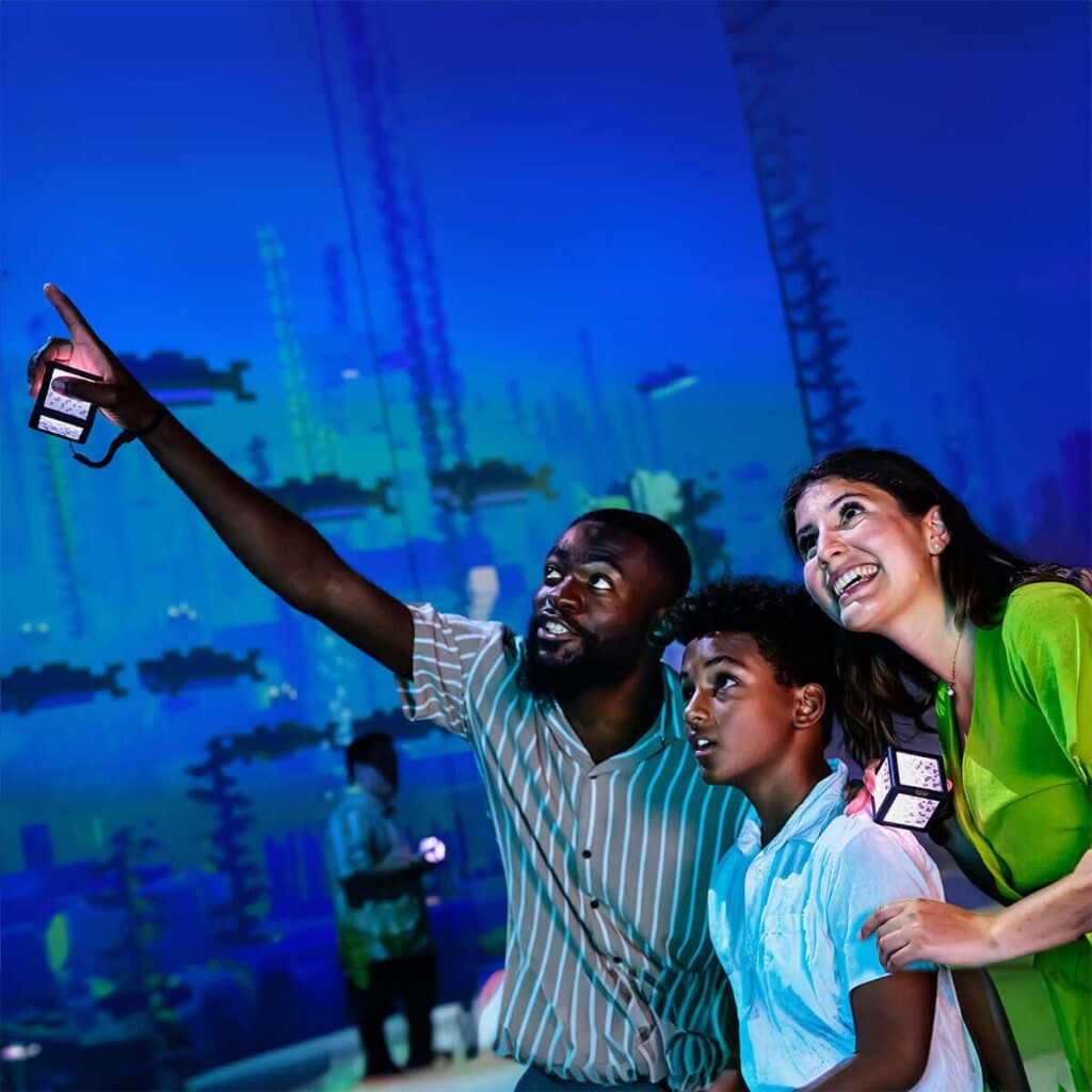 Visitors exploring biomes in Minecraft Experience Villager Rescue Singapore