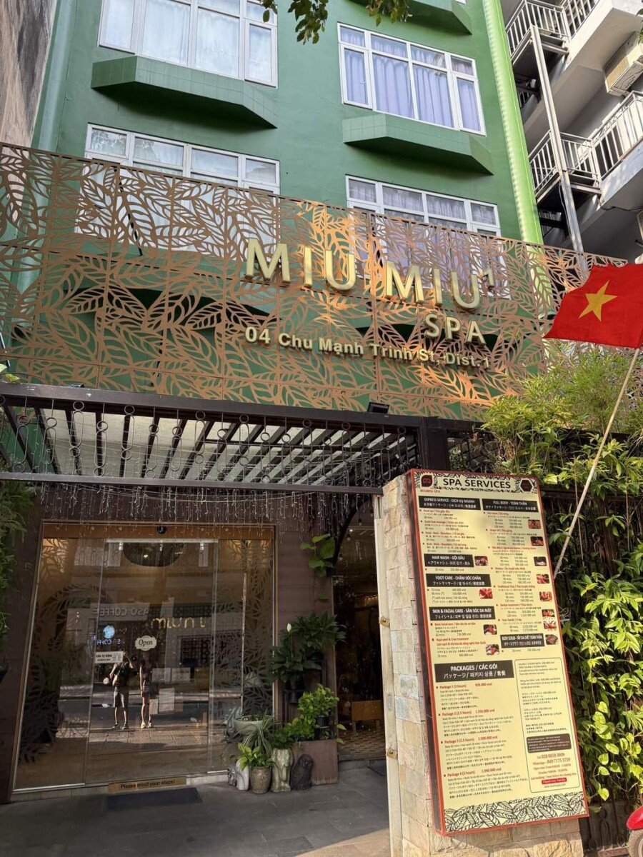 MiuMiu Spa shopfront at 04 Chu Manh Trinh, District 1, Saigon, with the full price list outside