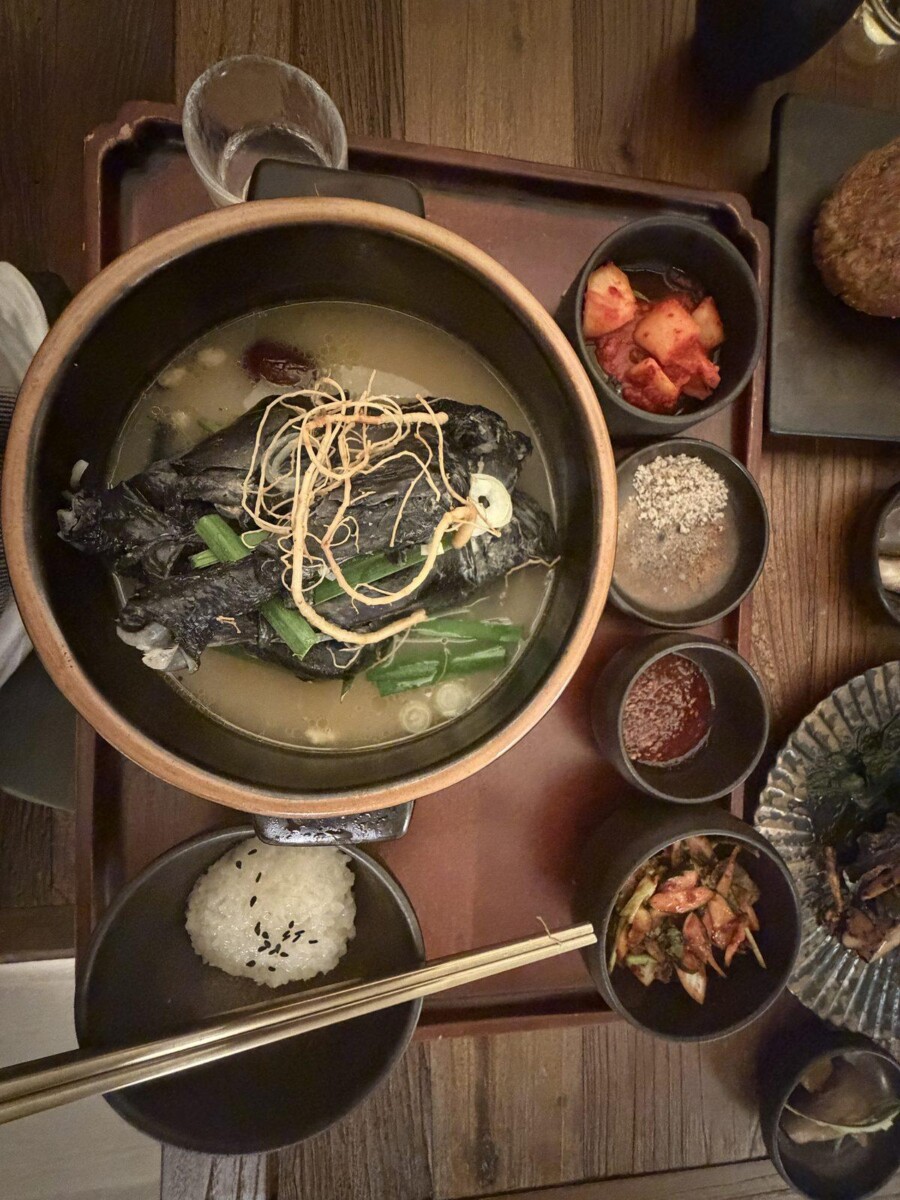 Black Chicken Samgyetang at MODU Samgyetang in clear golden broth with ginger threads, spring onions and goji berries