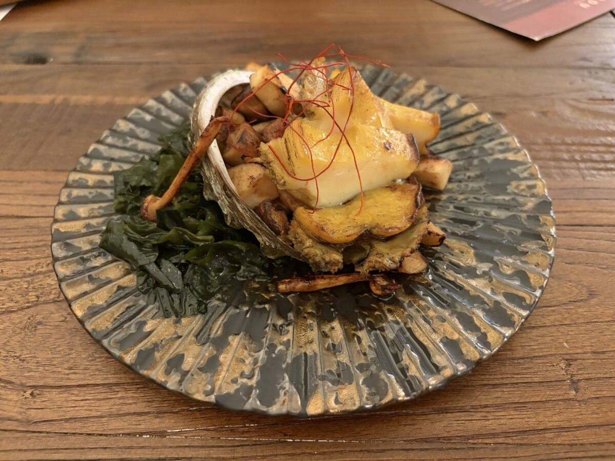 Butter Grilled Abalone served in its shell with sauteed mushrooms and red chilli threads at MODU Samgyetang