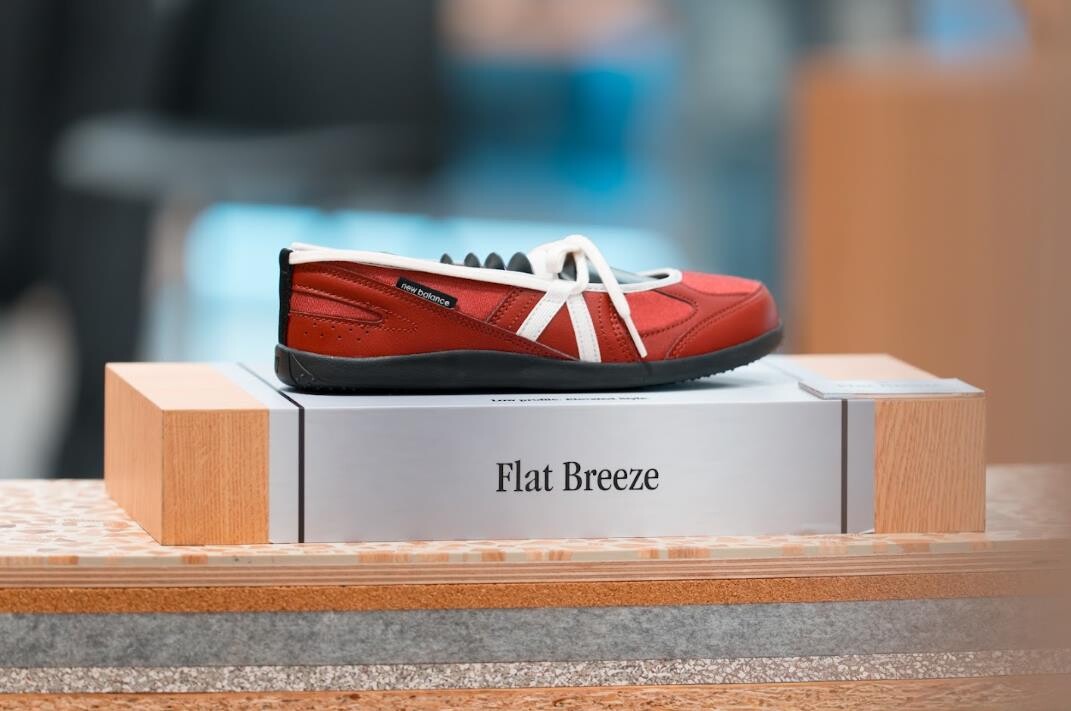 New Balance Flat Breeze in red on display at a New Balance store in Singapore