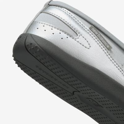 Rubber outsole and silver upper of the New Balance Flat Breeze