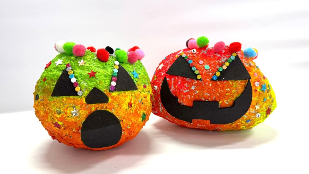 Children making paper mache trick-or-treat buckets at National Gallery Singapore