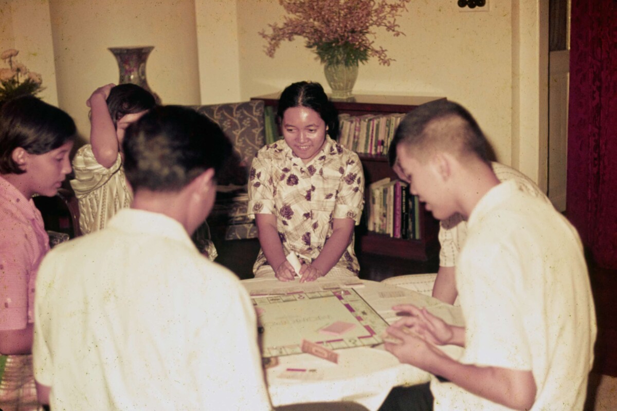 Family and relatives of Mr Yusof Ishak playing Monopoly