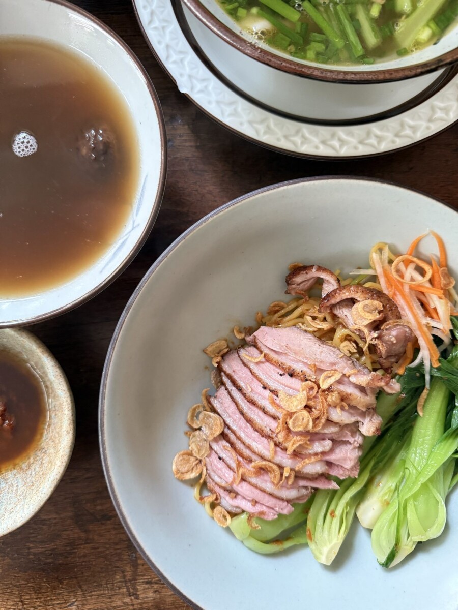 Homemade noodles with sliced duck breast, baby bok choy and fried shallots at NUC Saigon