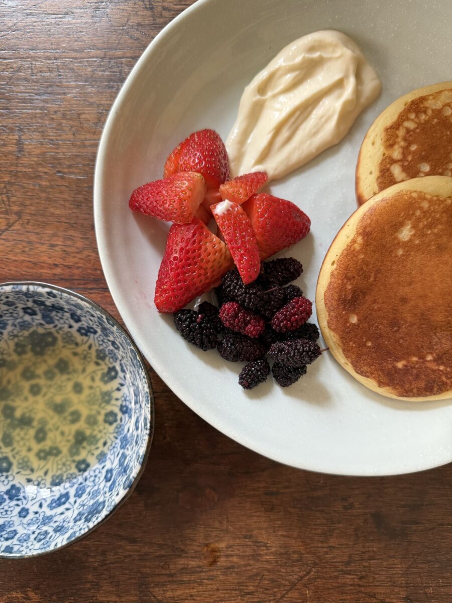 NUC Kitchen and Bar Saigon pancake dessert with fresh strawberries, mulberries and homemade yogurt
