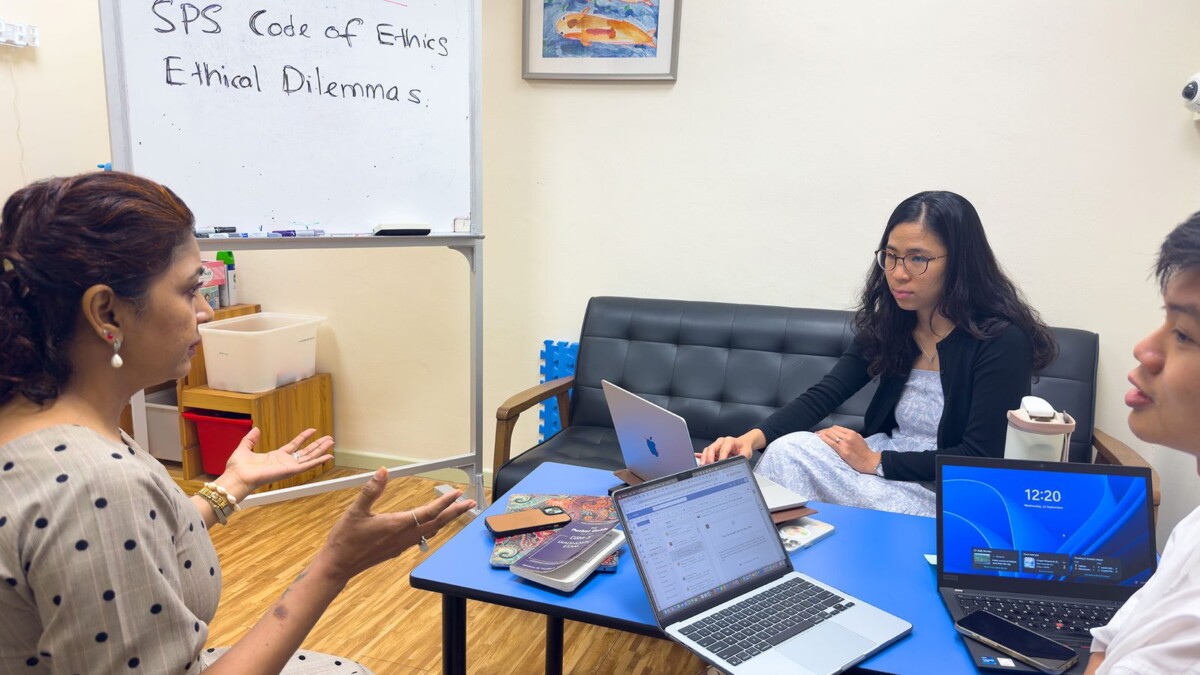 NUS clinical psychology staff discussing ethics coursework for the CDP-CP programme