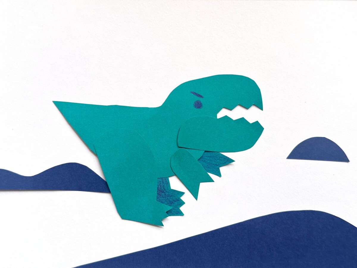Paper-cutout green dinosaur character made for the Drawn to Move stop-motion workshop