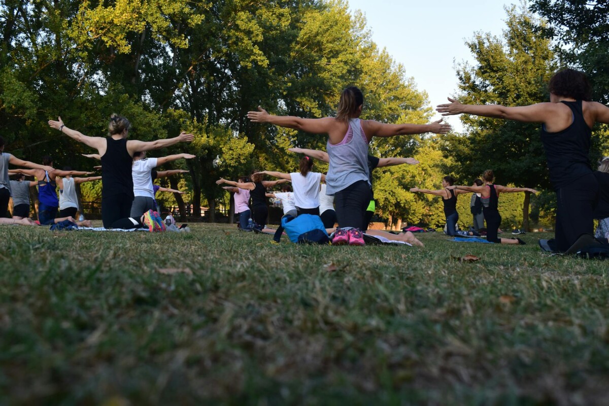 Active Singaporeans exercising outdoors in a park setting