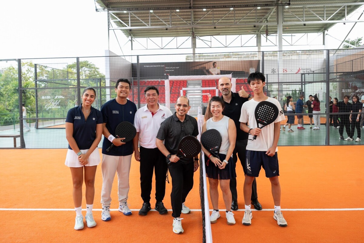 National padel players lead a coaching session at Padel at the Gardens