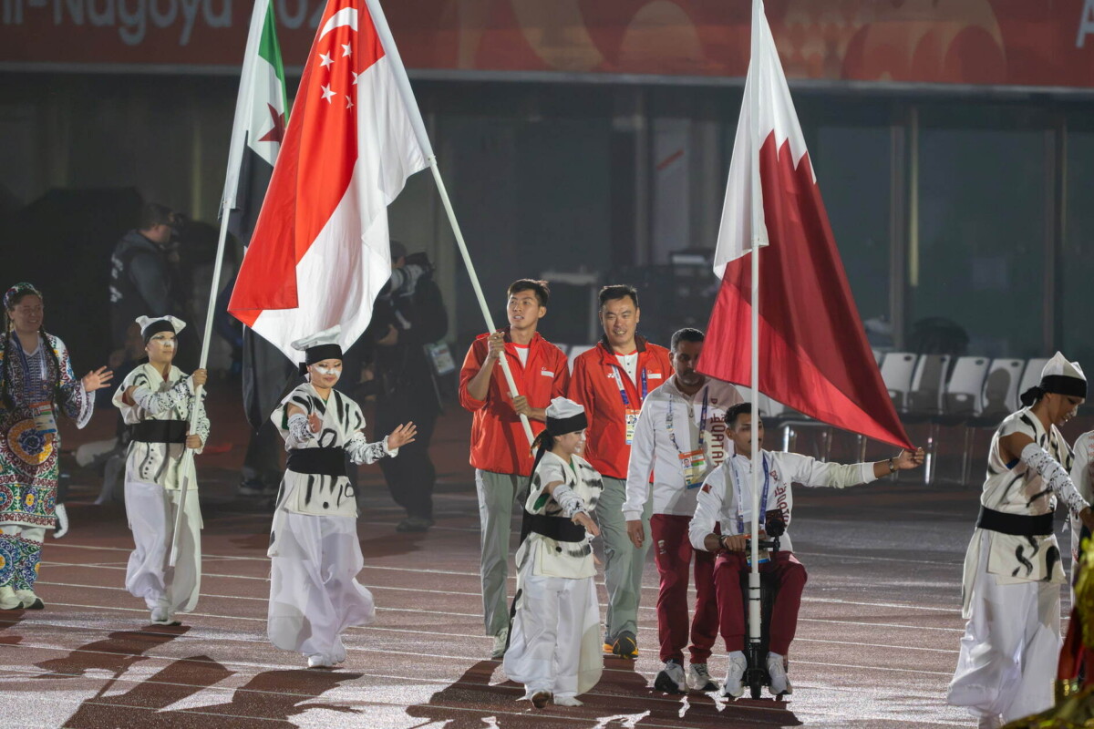 Flagbearers in the flag procession at the Asian Para Games closing ceremony