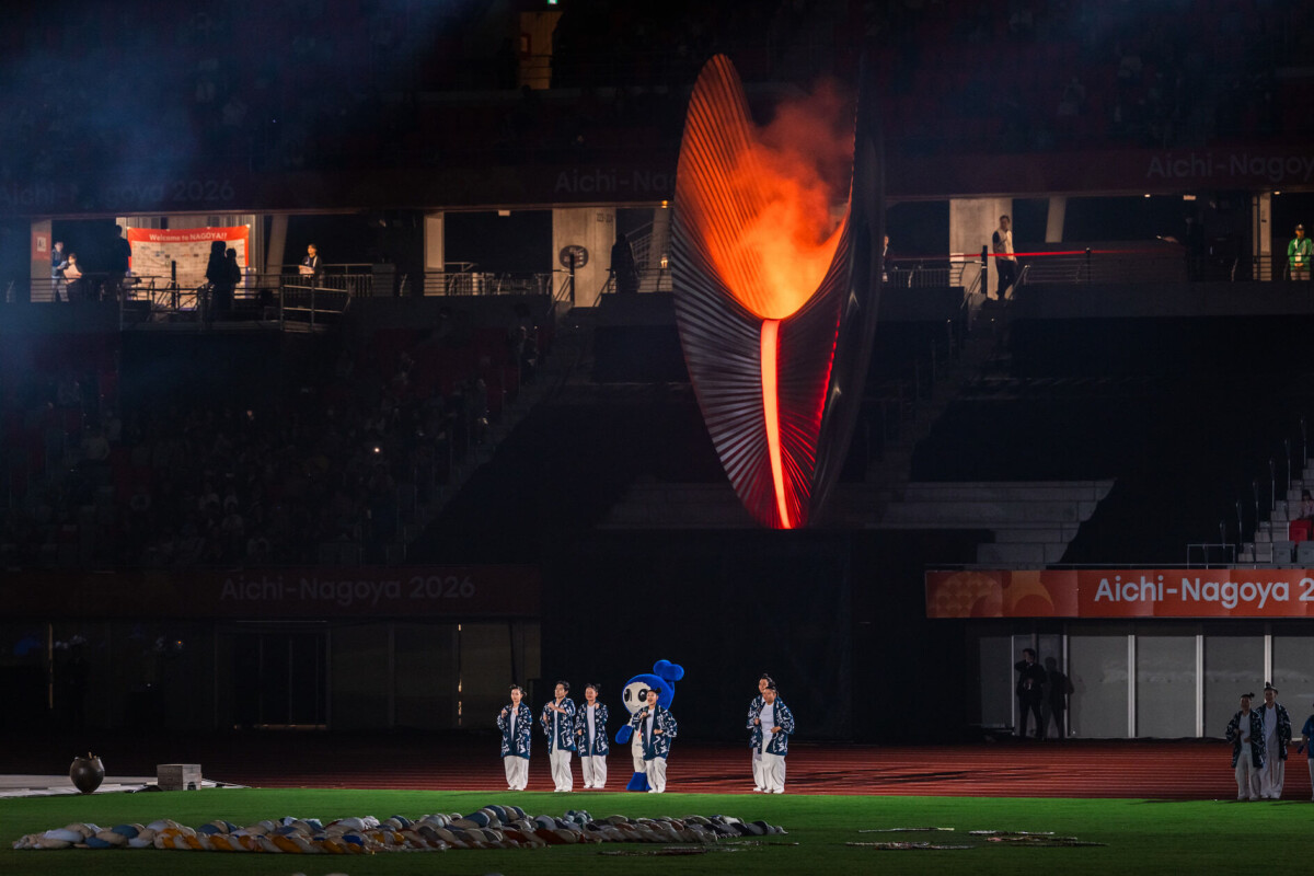 The Asian Para Games cauldron burning over the stadium