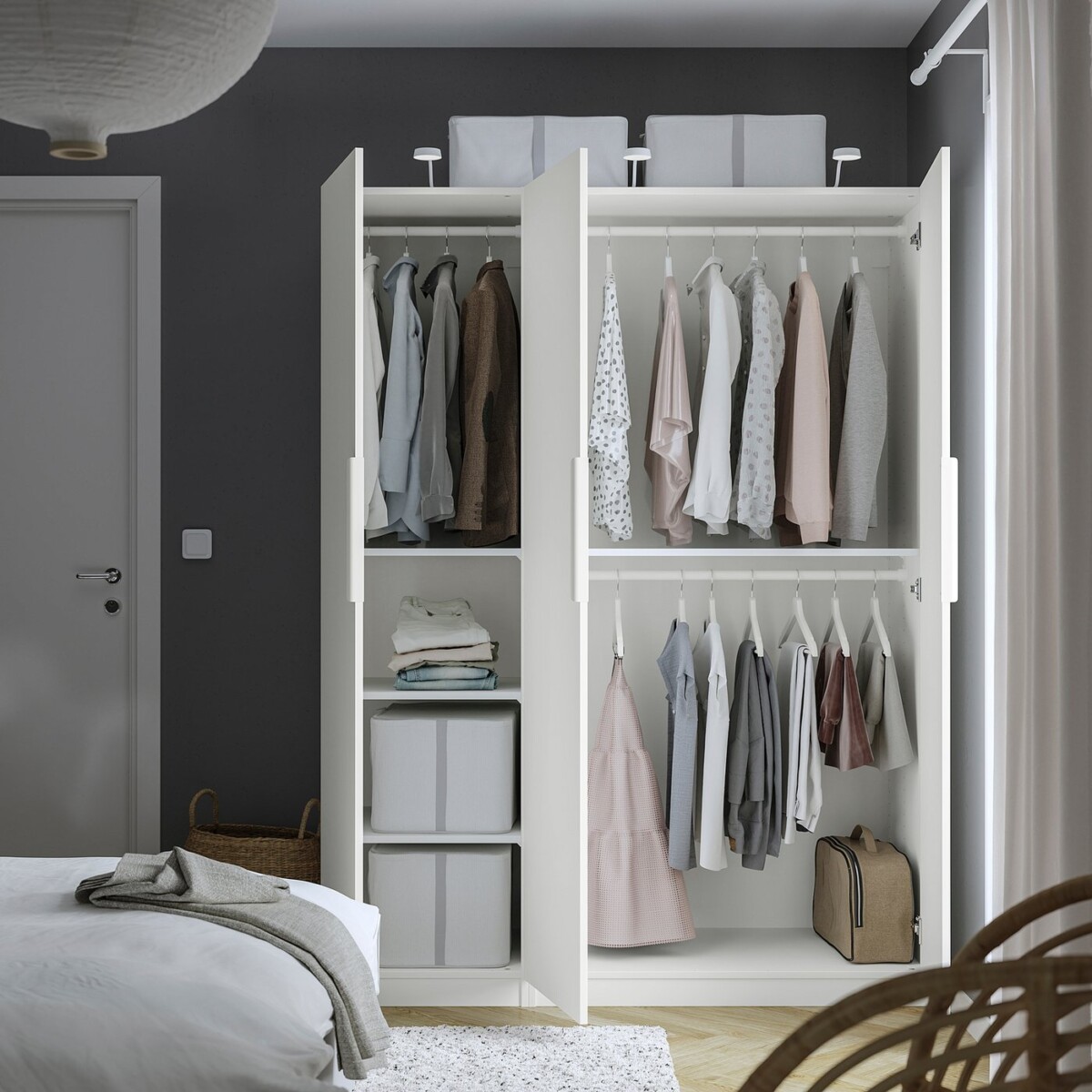 IKEA PAX FORSAND wardrobe open in a bedroom showing hanging rails and shelves