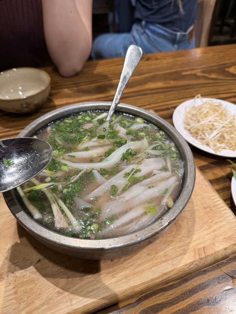 Pho noodles cooking in the hot wagyu broth at Pho Vietnam Saigon after the dunk
