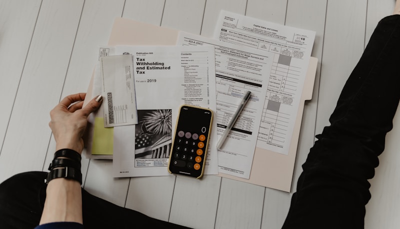 Person calculating savings interest on a calculator