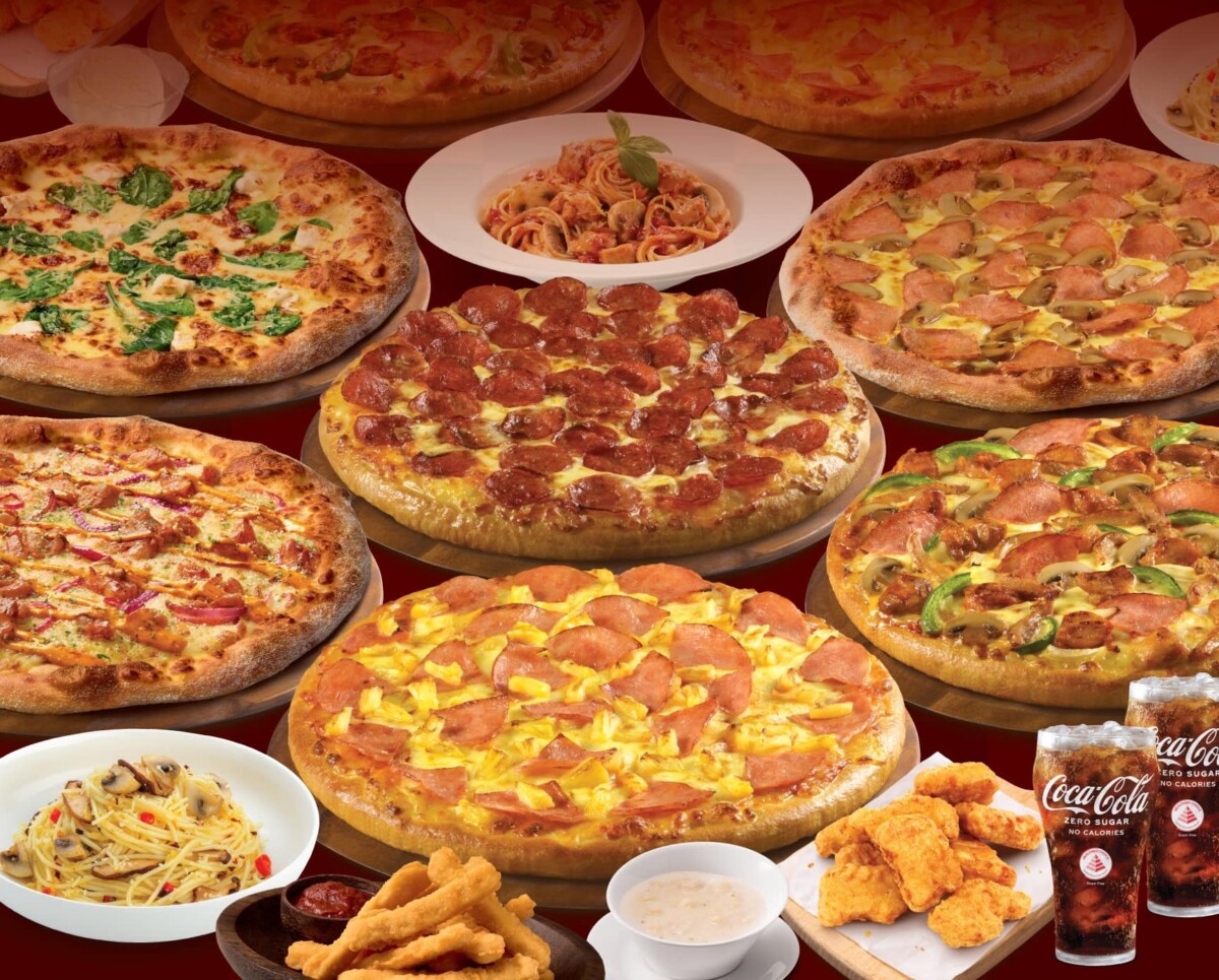 Pizza Hut Singapore buffet spread with pizzas, pasta, sides and drinks