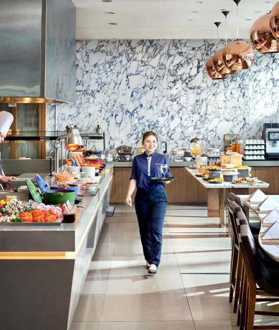 Buffet counters and dining room at Plate Carlton City Hotel