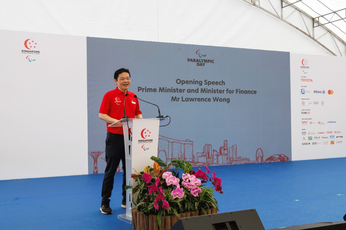 Prime Minister Lawrence Wong speaking at an official event podium