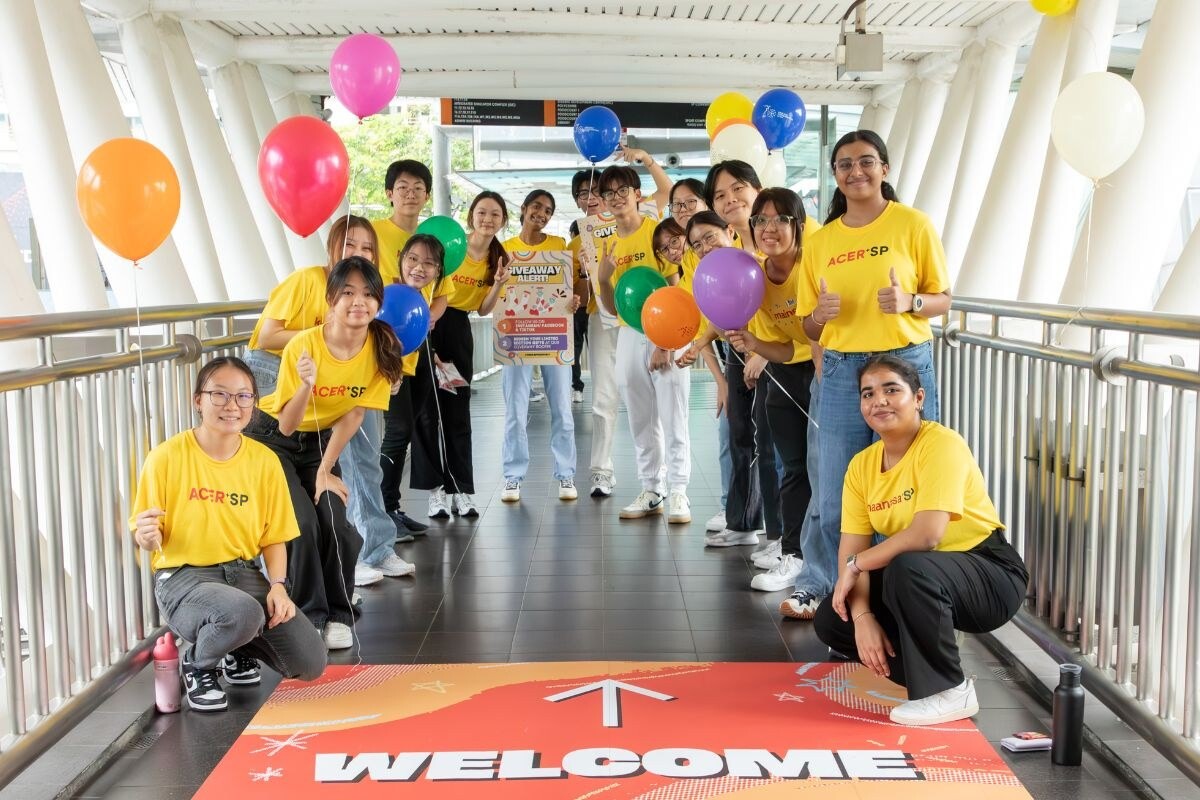 Singapore Polytechnic students with balloons on campus walkway