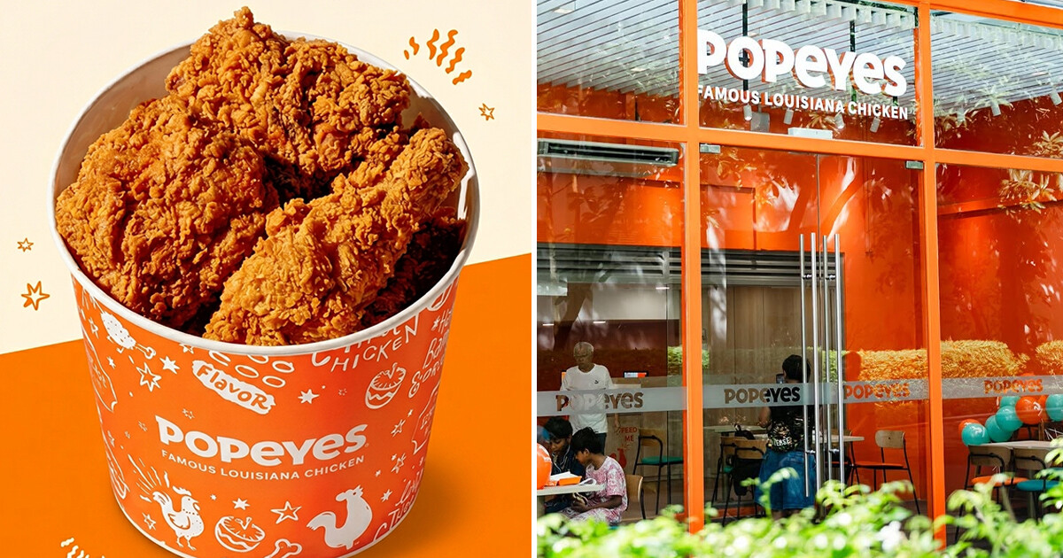 Popeyes fried chicken bucket beside a Singapore outlet exterior