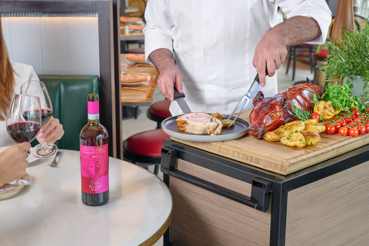 Chef Davide carving Maialino in Porchetta at Prego wine dinner