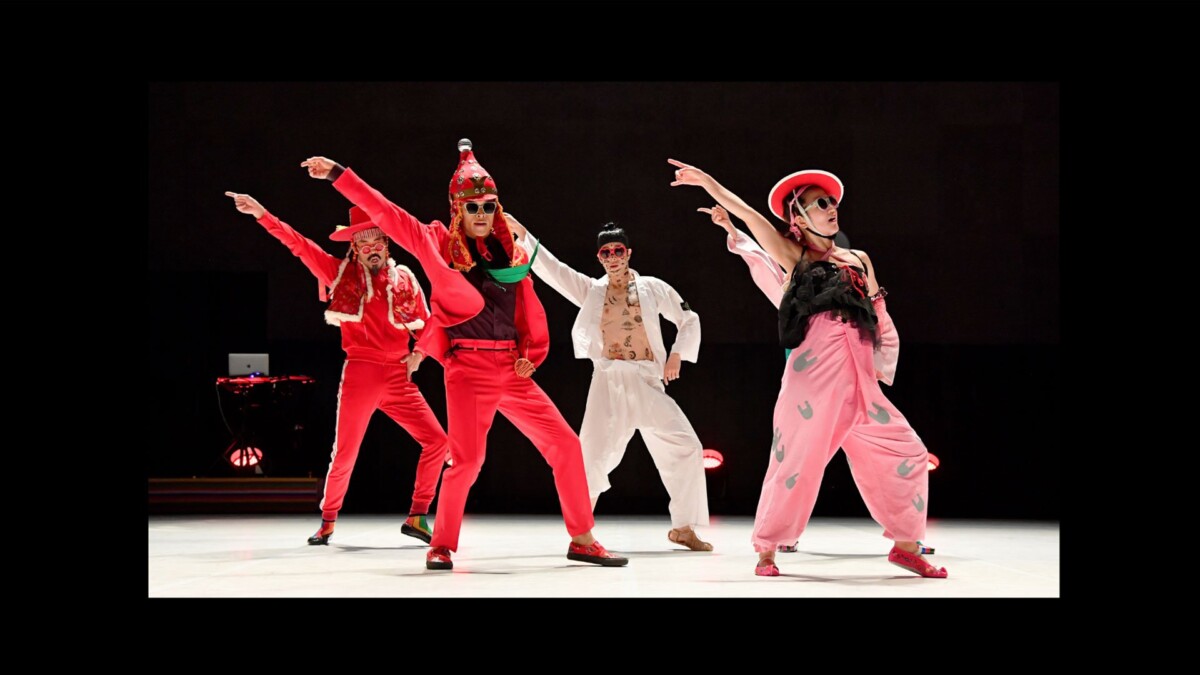 Ambiguous Dance Company dancers in FEVER performance costumes on stage