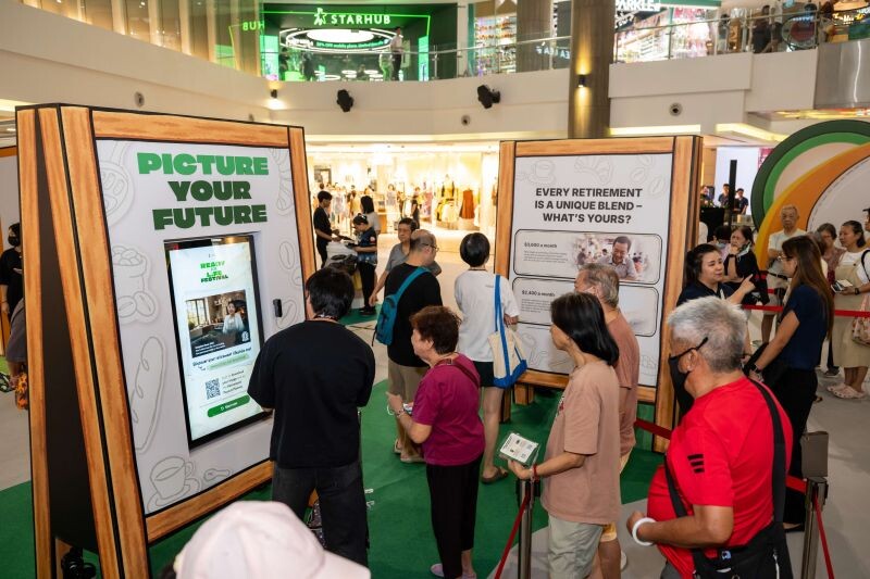 Visitors at the Picture Your Future station of the CPF Ready for Life Festival