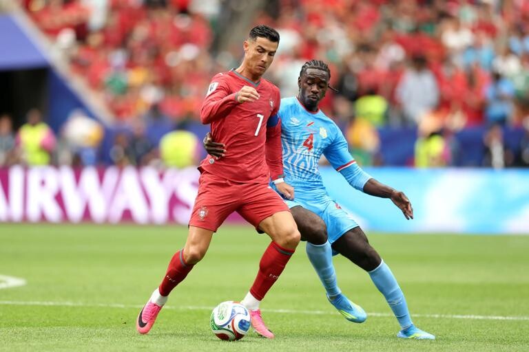 Cristiano Ronaldo of Portugal challenges Congo DR's Axel Tuanzebe during the FIFA World Cup 2026 Group K match