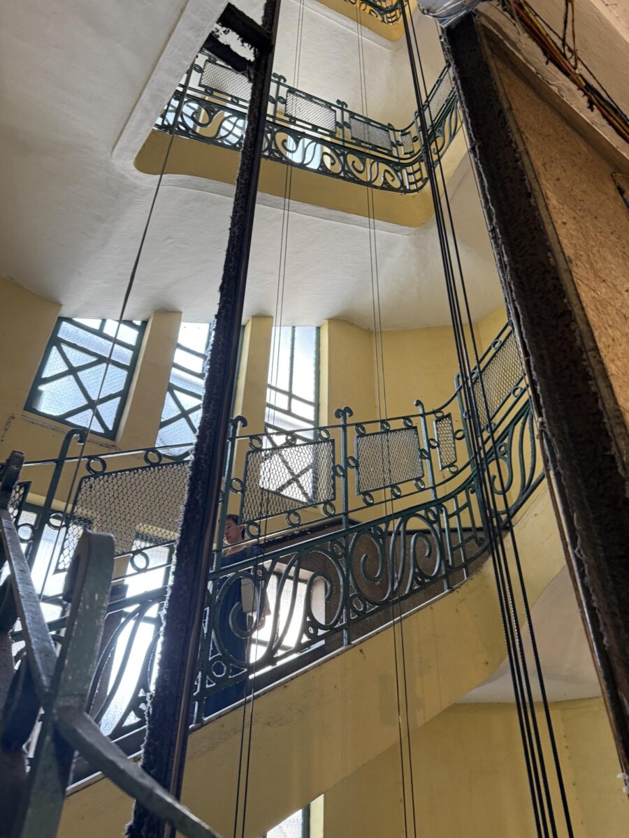 French colonial wrought-iron staircase spiralling up several floors at 26 Ly Tu Trong, Saigon